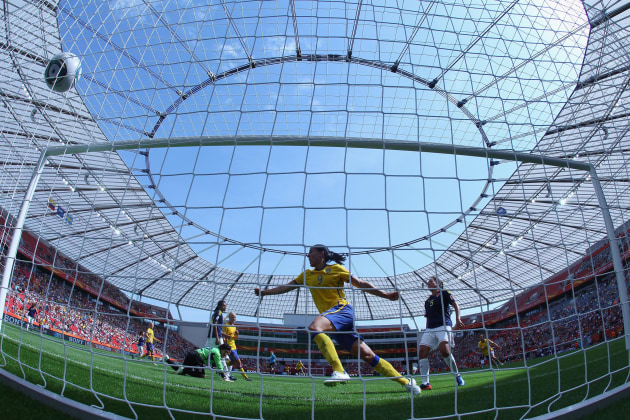 Jessica Landstrom of Sweden celebrates her goal at the 2011 FIFA Women's World Cup in Leverkusen, Germany. Canon EOS 1D Mk IV, 15mm lens. 1/1250s @ f10, ISO 400.