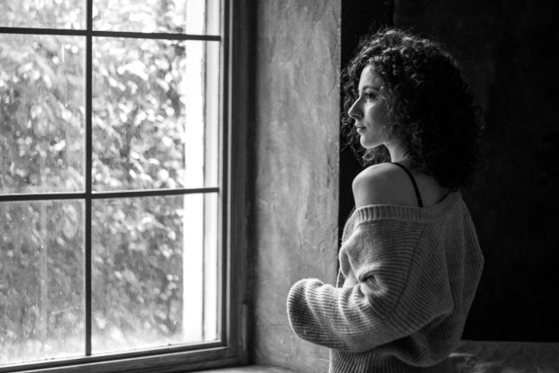 Contrasting soft window light with a dark background creates an ideal environment for natural light portraiture. Image: Anastasia Serdyuk