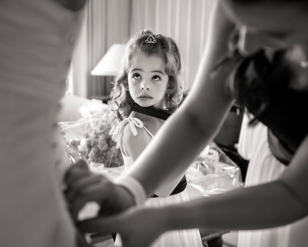 One of the challenges of being a wedding photographer is keeping aware of everything that is going on around you. While some people can often get fixated looking at the bride, it can often be the little people in the scene that can make for the interesting photos. Nikon D700, 24-70mm f2.8 lens @ 48mm. 1/100s @ f3.2, ISO 800.